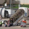 Passengers board a flydubai flight, bound for Dubai, before taking off from Ben Gurion Airport near Tel Aviv on September 30, 2026. 