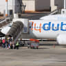 Travelers board a flydubai aircraft at Ben Gurion International Airport after a separate FlyDubai flight from the United Arab Emirates to Israel was diverted to Saudi Arabia following an emergency signal, on September 30, 2026.