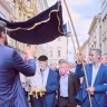 Vienna Jews celebrating the renovation of the Stadttempel synagogue walk a new Torah scroll through the streets, Vienna, Sept. 9, 2026.