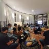 A Salon Otef participant shares her personal story with guests gathered in a private home.