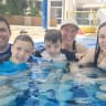 THE FAMILY enjoys a dip. 