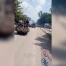 Vehicles carrying armed men drive along a street in Alamata, Ethiopia, after a pro-government militia said that Ethiopia's military and allied militiamen had captured the town, in this screengrab from a social media video released on September 28, 2026.
