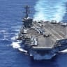 The USS Theodore Roosevelt from the bay doors of a V-22 Osprey after taking off during a Rim of the Pacific (RIMPAC) military exercise in waters south of the Hawaiian Islands, U.S., July 13, 2026. 