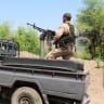 Members of the Saudi-backed Yemeni government forces ride on a military pick-up vehicle as they patrol a road leading to a frontline of clashes with Iran-aligned Houthi fighters, in Taiz province, Yemen, September 30, 2026. 