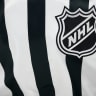 A detail of the NHL logo is seen on a referee's jersey during the game between the Seattle Kraken and the Anaheim Ducks at Climate Pledge Arena on January 23, 2026 in Seattle, Washington; Illustrative.