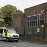 A police car patrols the area around Heaton Park Shul on October 02, 2026 in Manchester, England. 