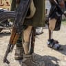 Disabled Saudi-backed Yemeni government soldiers gather at the Jabal Han front west of the city of Taiz following fierce battles earlier in the day as Yemen's Houthis reportedly attempted to seize control of the main route between the inland city of Taiz and the coastal city of Aden, on October 3.