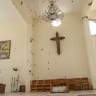 A gaping hole in the wall of a church following Israeli military activity in the southern Lebanese village of Zawtar al-Gharbiyah on August 8, 2026.  