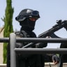 A member of the Palestinian security forces stands guard during the eighth Fatah Conference in Ramallah, in the West Bank, May 14, 2026