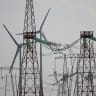 Wind turbines amd electric-line systems are pictured near Saraiu village, Romania on August 12, 2026.