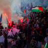 Demonstrators hold lit flares behind a banner reading AUTODEFENSE Lyceenne, amid smoke and flags. Grenoble, Isere, France, October 6, 2026. 