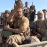 Pro-Saudi-backed Yemeni government fighters sit in the back of a vehicle during what government forces say was an advance against the Iran-backed Houthis, near Dhubab, Taiz Governorate, Yemen, in this still image taken from video released October 5, 2026. 