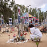 A woman cries at the Nova music festival memorial site on October 6, 2026. 