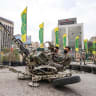 Iranians in camouflage outfits demonstrate the use of a double-barrel anti-aircraft gun during the inauguration of a training centre by the Iranian army for "Jan-Fadayan" (those willing to sacrifice their lives) volunteers, at Haft-e-Tir Square in central Tehran on October 3, 2026.