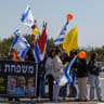 People pay their respects during the funeral service of late Israeli hostages Shiri Bibas and her children Ariel and Kfir, in the Goma junction, northern Israel, February 26, 2025.