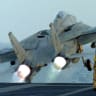 A US F-14 fighter takes off from the main deck of the USS Enterprise early 09 October 2001 as a second wave US-led air attacks on Afghanistan was launched with residents of Kabul reporting bombs hitting targets on the outskirts of the city.