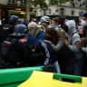 French riot gendarmes attempt to move protesters standing behind a barricade to block the Boulevard Saint-Germain amid clashes during a protest outside Sciences Po university in Paris as part of nationwide student protests demanding better school conditions, France, October 7, 2026.