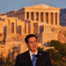US Secretary of State Marco Rubio speaks at the Pnyx hill, where ancient Athenians held democratic assemblies, with the ancient Parthenon temple atop the Acropolis in the background, in Athens, Greece October 7, 2026.