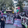 Pro-Palestinian protesters gather on Oct. 7, 2026, outside City Hall in New York.