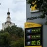 A bird flies near a price board at a Rosneft petrol pump amid fuel shortages following recent series of Ukrainian air attacks on oil refineries in Russian regions and further gasoline production cuts, in the course of the Russia-Ukraine conflict, in Moscow, Russia, August 14, 2026. 