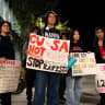 Cornell University students holds signs after a seven-hour-long sit-in protest representing the seven hours that a Jane Doe alleges she was sexually assaulted in a case involving seven members of Cornell’s Chi Phi fraternity, in Ithaca, New York, US, October 7, 2026.