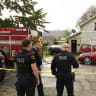 Police stand outside the home at 722 Perry Street where 9 members of a family were killed in an apparent domestic dispute on October 10, 2026 in Erie, Pennsylvania. 