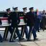 US President Donald Trump and Secretary of Defense Pete Hegseth salute as a US Army carry team carries the flag-draped transfer case containing remains during a dignified transfer event for US service members killed in the Middle East, at Dover Air Force Base in Dover, Delaware, on July 22, 2026. 