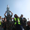 A Houthi supporter wearing a military uniform holds a mock missile as he joins Houthi supporters in a rally to show support to the movement as fighting intensifies across several Yemeni fronts, in Sana'a, Yemen, October 9, 2026