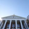 The Harvard University Coat of arms (Ve Ri Tas) is displayed on the front of the Harvard Business School building on October 25, 2025 in Boston, Massachusetts