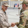 Maj.-Gen. Sean M. Salene, the US Central Command's Director of Strategy, Plans, and Policy (J-5), is greeted by Maj. Samuel H. Waterman, the 380th Expeditionary Security Forces Squadron commander, at Al Dhafra Air Base, United Arab Emirates, September 27, 2022 