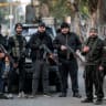 Members of a local rebel militia pose for a picture during a patrol in Syria's southern city of Sweida.