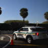 Illustrative:  member of the Palm Beach County Sheriffs' office parks a patrol car outside of Mar-a-Lago club as part of the security for US President Donald Trump in Palm Beach, Florida on December 20, 2025. 