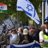 A counter-protest displaying Israeli flags watches as a National March in support of Palestine, organized by Palestine Solidarity Campaign, moves through central London on October 10, 2026