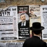 Campaign posters against Shas head Aryeh Deri are seen in the ultra-Orthodox Jewish neighborhood of Mea Shearim, in Jerusalem, August 31, 2026