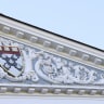 The Harvard University Coat of arms (Ve Ri Tas) is displayed on the front of the Harvard Business School building on October 25, 2025 in Boston, Massachusetts. 