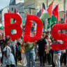 Demonstrators hold BDS (Boycott, Divestment, Sanctions) lettering calling for action against Israel during the "No Weapons For Israel" march to Leipzig/Halle Airport in protest against German arms deliveries to Israel.