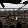 FILE PHOTO: Ukrainian soldiers Pavlo and Dorokhin retrieve a Starlink satellite connection hardware from a roof of a damaged university, as Russia’s attack on Ukraine continues, from a recent missile attack in Kramatorsk Ukraine, December 13, 2022.