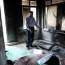 A Palestinian checks damage in a mosque, which Palestinians say was burned by Israeli settlers, in Mukhmas, near Ramallah in the West Bank, October 14, 2026.