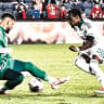MACCABI HAIFA’S Pedro Brazao beats Hapoel Jerusalem ’keeper Nadav Zamir during the Greens’ 4-1 Premier League away victory in the capital.