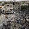 Palestinians inspect the site of a house targeted by airstrikes after the Israeli military warned residents to evacuate late on Saturday, in Al-Zawayda, central Gaza Strip, October 11, 2026.