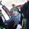 Illustrative: An Iranian woman member of the Basij militia's Ashura battalion takes part in a military parade to mark the national Basij week at a military base of Iran's elite Revolutionary Guards in northeastern Tehran on November 25, 2008.