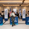 Attendees arrive at a NBN's aliyah advisors. 