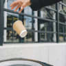 He could throw the empty cup out the window, thinking no one will notice.