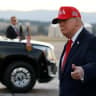 US President Donald Trump gestures as he arrives at Glacier Park International Airport in Kalispell, Montana, US, October 14, 2026.