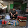  Palestinian vendor sells goods at a street market in Gaza City, October 16, 2026.