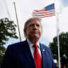 US President Donald Trump looks on while he speaks to reporters as he departs the White House for Joint Base Andrews en route to Dalton, Georgia, on the South Lawn of the White House in Washington, DC, US, October 16, 2026. 