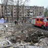 A resident looks at a crater that appeared at the site of an apartment building damaged during a Russian air strike, amid Russia's attack on Ukraine, in Zaporizhzhia, Ukraine October 17, 2026