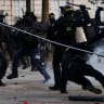 A police officer falls during a demonstration as part of nationwide protests called by the "Yellow Vests" movement against the cost of living and rising fuel prices, in Nantes, France, October 17, 2026.