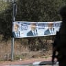 A banner featuring Prime Minister Benjamin Netanyahu is displayed near Palestinian-owned olive groves in the village of Rantes near Ramallah, in the West Bank, October 6, 2026