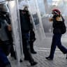 A protester faces off with a police unit during an anti-government demonstration in central Tirana on October 17, 2026, as protests continued for a fifth consecutive day over university conditions and demands for the resignation of Albanian Prime Minister Edi Rama.